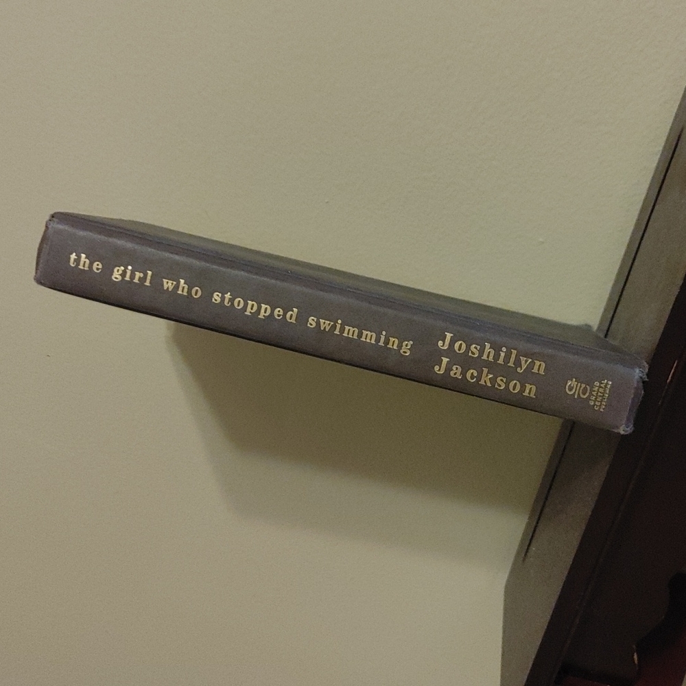 A book. 'The Girl Stopped Swimming' by Joshilyn Jackson.